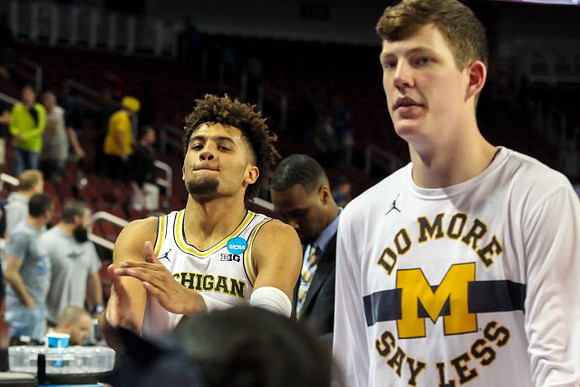 Isaiah Livers (4) and Jon Teske (15)