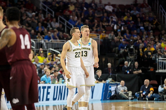 Duncan Robinson (22) and Moritz Wagner (13)