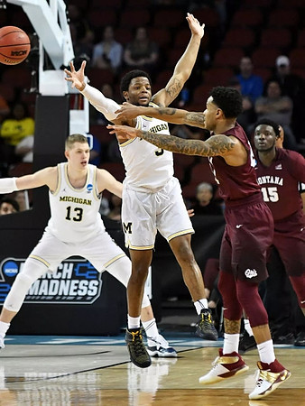 Moritz Wagner (13) and Zavier Simpson (3)