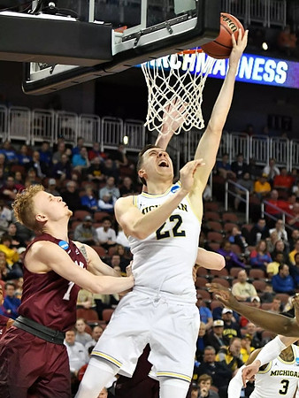 Duncan Robinson (22) and Zavier Simpson (3)