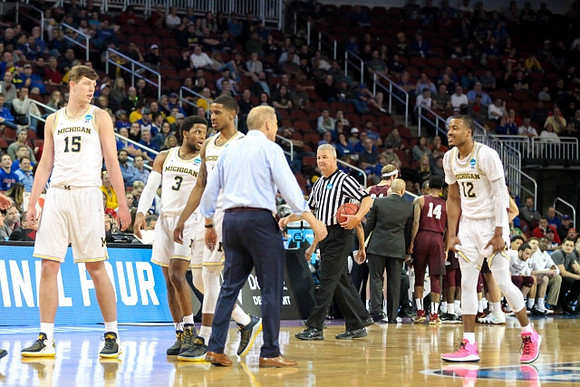Jon Teske (15), Zavier Simpson (3), Charles Matthews (1), John Beilein, and Muhammad-Ali Abdur-Rahkman (12)