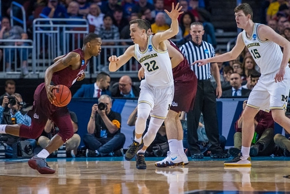 Duncan Robinson (22) and Jon Teske (15)