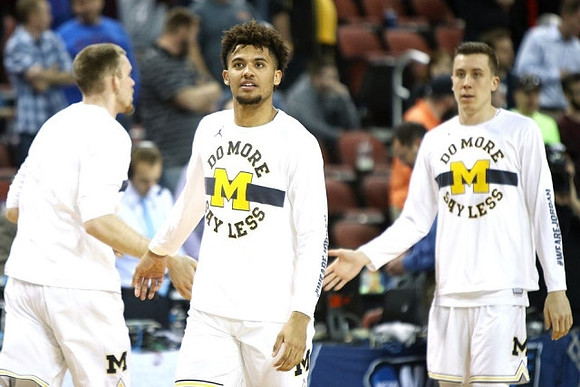 Austin Davis (51), Isaiah Livers (4), and Duncan Robinson (22)