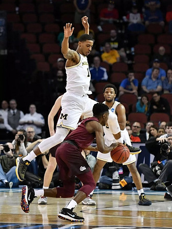 Charles Matthews (1) and Zavier Simpson (3)