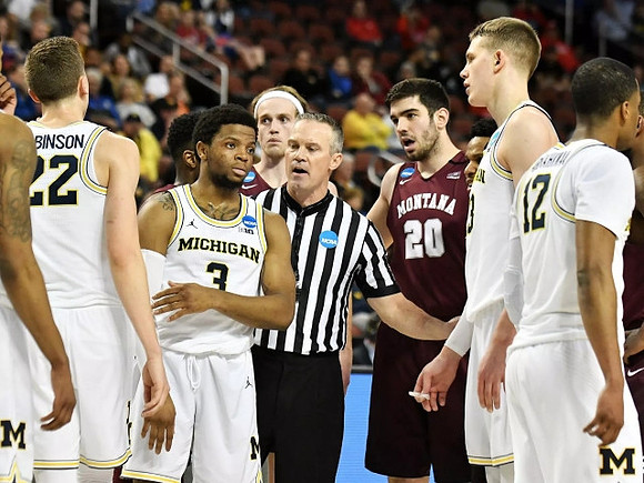 Duncan Robinson (22), Zavier Simpson (3), Moritz Wagner (13), and Muhammad-Ali Abdur-Rahkman (12)