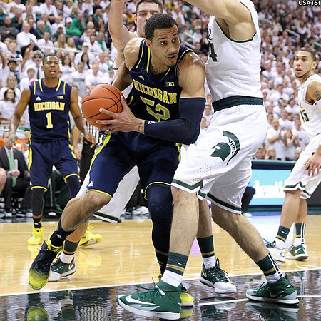 Glenn Robinson III (1) and Jordan Morgan (52)
