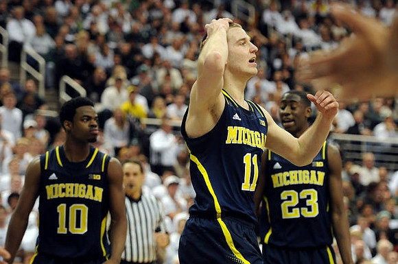 Derrick Walton Jr. (10), Nik Stauskas (11), and Caris LeVert (23)