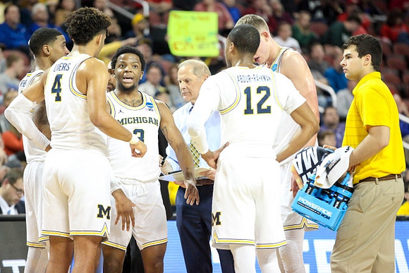 Charles Matthews (1), Isaiah Livers (4), Zavier Simpson (3), John Beilein, Muhammad-Ali Abdur-Rahkman (12), and Moritz Wagner (13)