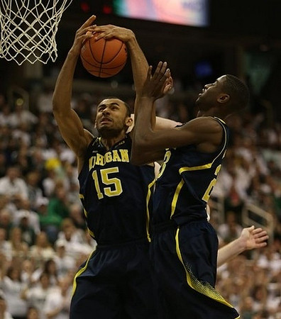 Jon Horford (15) and Caris LeVert (23)