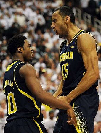 Derrick Walton Jr. (10) and Jon Horford (15)