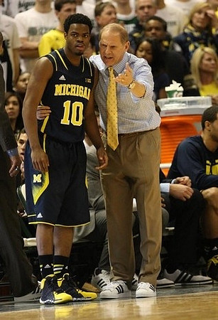 Derrick Walton Jr. (10) and John Beilein