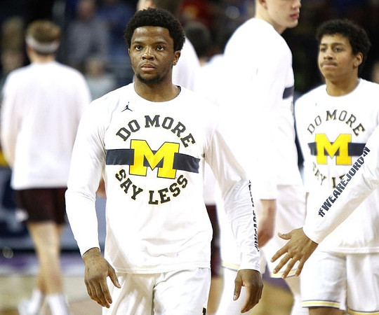 Zavier Simpson (3) and Eli Brooks (55)