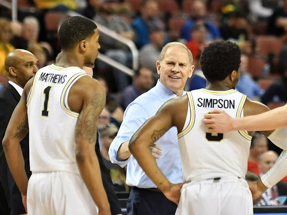 Saddi Washington, Charles Matthews (1), John Beilein, and Zavier Simpson (3)