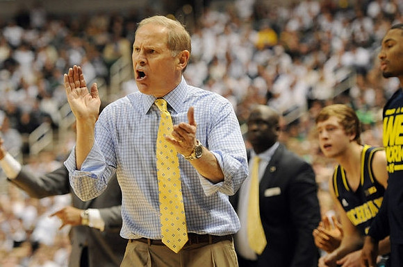 John Beilein, Bacari Alexander, Spike Albrecht (2), and Zak Irvin (21)