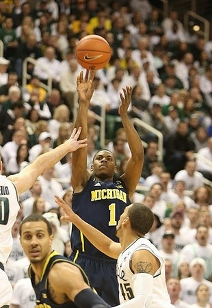 Jordan Morgan (52) and Glenn Robinson III (1)