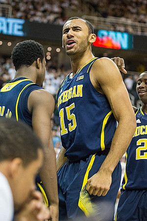 Derrick Walton Jr. (10), Jon Horford (15), and Caris LeVert (23)