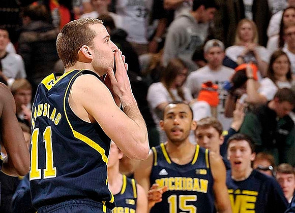 Nik Stauskas (11) and Jon Horford (15)
