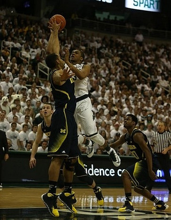 Nik Stauskas (11), Jon Horford (15), and Derrick Walton Jr. (10)
