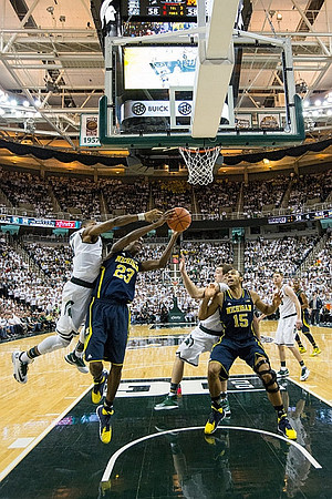 Caris LeVert (23) and Jon Horford (15)
