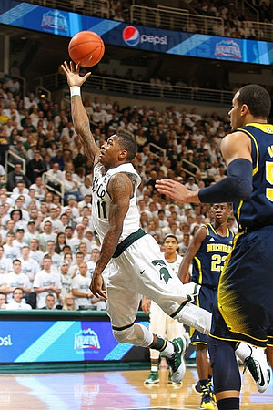 Caris LeVert (23) and Jordan Morgan (52)