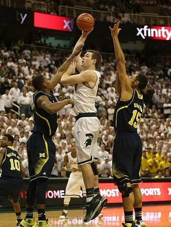 Derrick Walton Jr. (10), Glenn Robinson III (1), and Jon Horford (15)