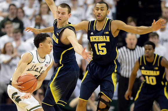 Nik Stauskas (11), Jon Horford (15), and Derrick Walton Jr. (10)