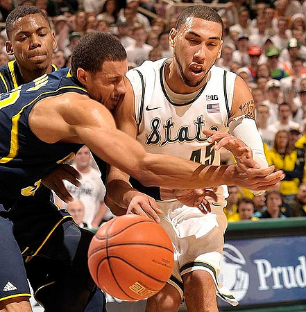 Glenn Robinson III (1) and Jordan Morgan (52)