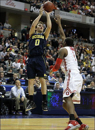 Zack Novak (0) and John Beilein