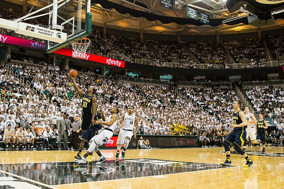 Derrick Walton Jr. (10), Nik Stauskas (11), and Max Bielfeldt (44)