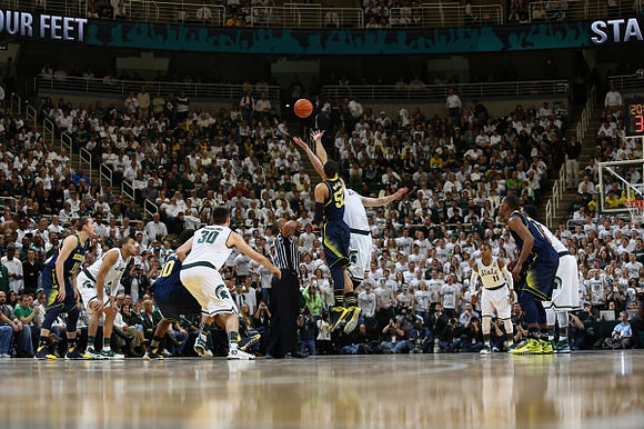 Nik Stauskas (11), Derrick Walton Jr. (10), Jordan Morgan (52), and Glenn Robinson III (1)