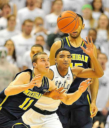 Nik Stauskas (11) and Jon Horford (15)