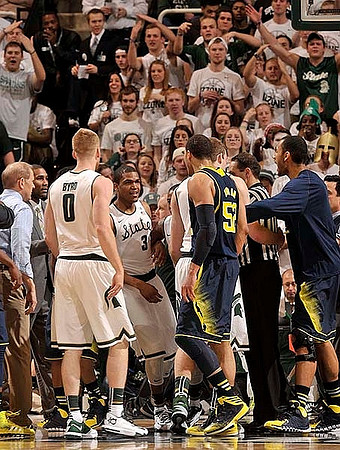 John Beilein, Jordan Morgan (52), and Jon Horford (15)