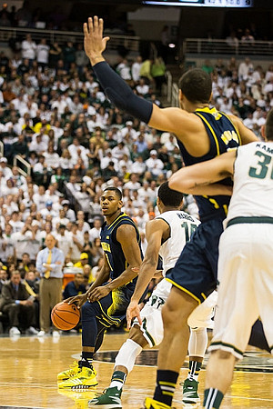 Glenn Robinson III (1) and Jordan Morgan (52)