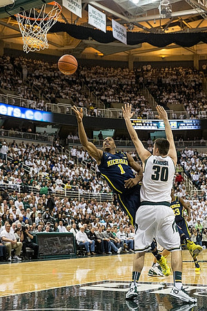 Glenn Robinson III (1) and Caris LeVert (23)