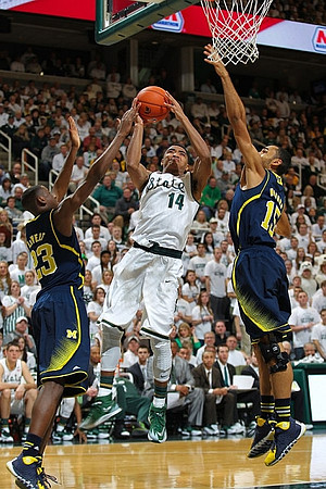 Caris LeVert (23) and Jon Horford (15)