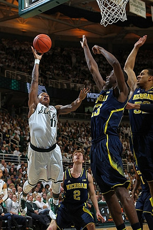 Spike Albrecht (2), Caris LeVert (23), Jordan Morgan (52), and Glenn Robinson III (1)