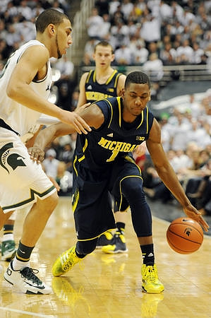 Glenn Robinson III (1) and Nik Stauskas (11)