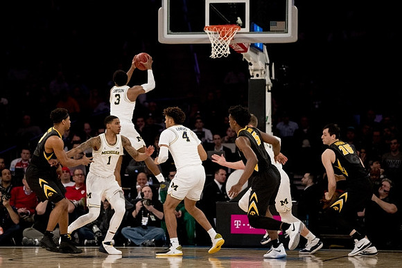 Charles Matthews (1), Zavier Simpson (3), and Isaiah Livers (4)