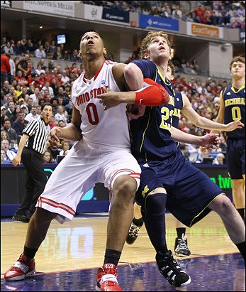 Evan Smotrycz (23) and Zack Novak (0)