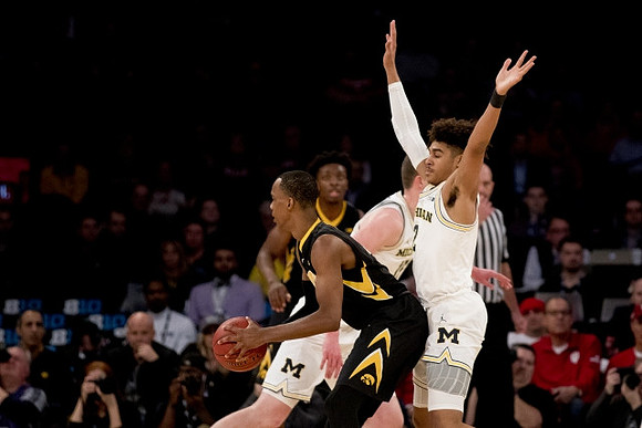 Jon Teske (15) and Jordan Poole (2)