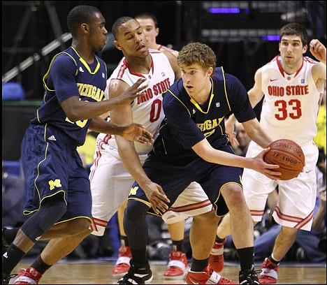 Tim Hardaway Jr. (10) and Evan Smotrycz (23)