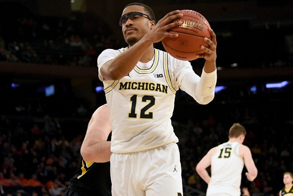 Muhammad-Ali Abdur-Rahkman (12) and Jon Teske (15)