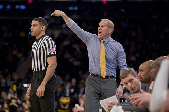 John Beilein, Luke Yaklich, Saddi Washington, and Deandre Haynes