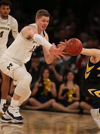 Isaiah Livers (4) and Moritz Wagner (13)