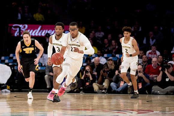 Zavier Simpson (3), Muhammad-Ali Abdur-Rahkman (12), and Jordan Poole (2)