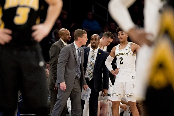 Saddi Washington, Luke Yaklich, Deandre Haynes, Duncan Robinson (22), and Jordan Poole (2)