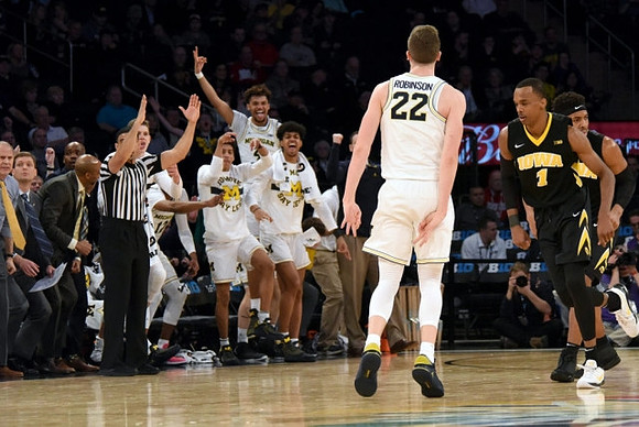 Duncan Robinson (22) and Michigan Team