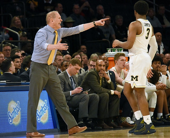 John Beilein, Zavier Simpson (3), and Michigan Team