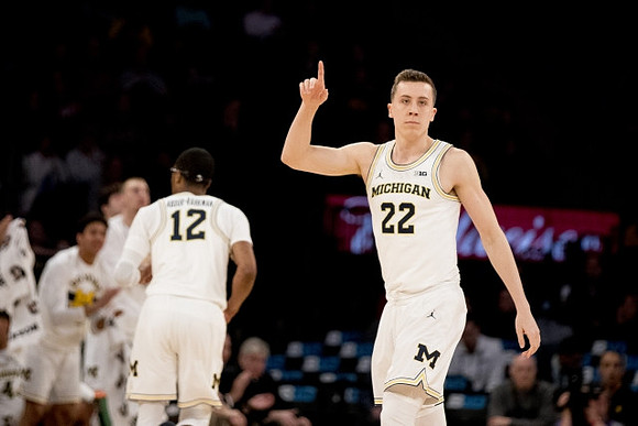 Muhammad-Ali Abdur-Rahkman (12) and Duncan Robinson (22)