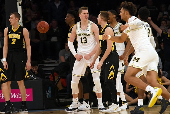 Moritz Wagner (13), Charles Matthews (1), Isaiah Livers (4), and Zavier Simpson (3)